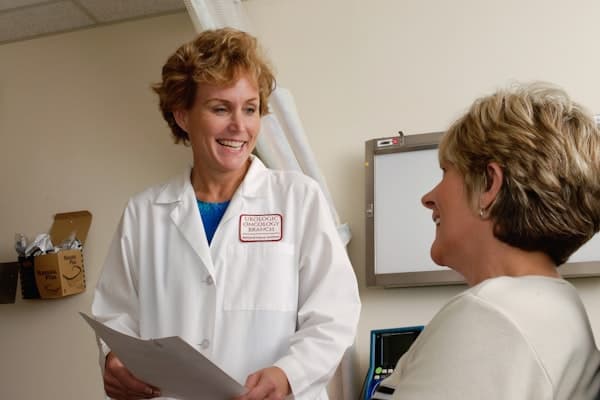 Patient receiving wait time notification on phone