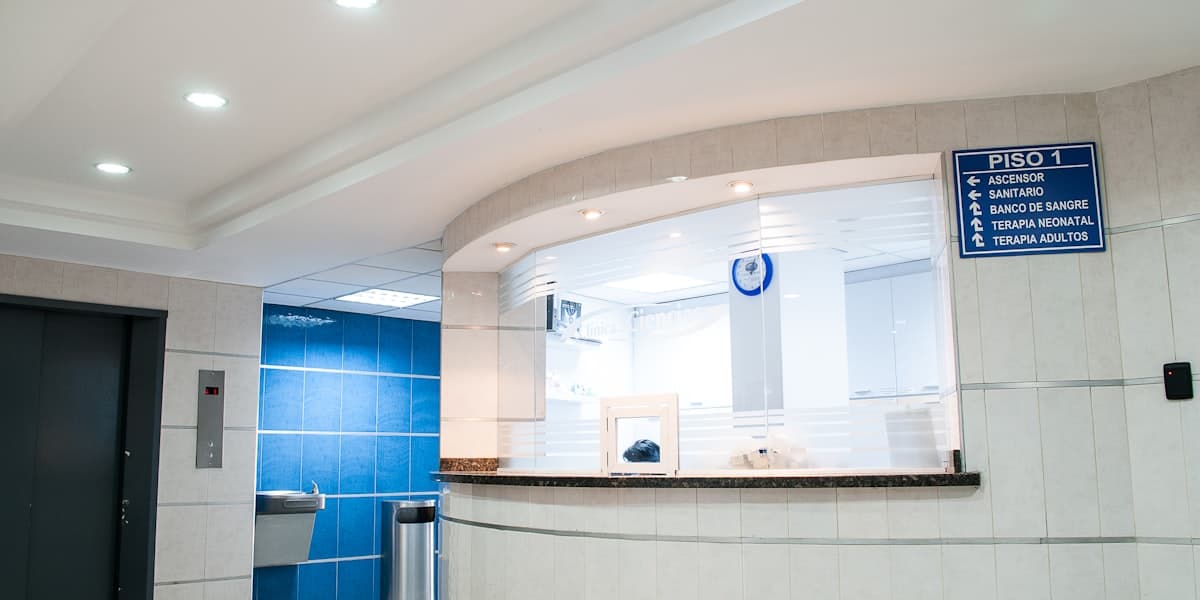 Modern clinic waiting room with digital queue display